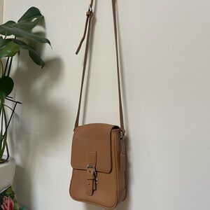 90s vintage Coach tan leather crossbody bag with snap closure and back pocket